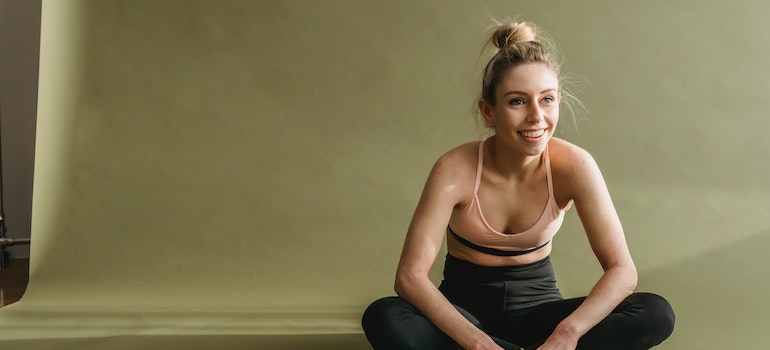 Smiling woman doing yoga.