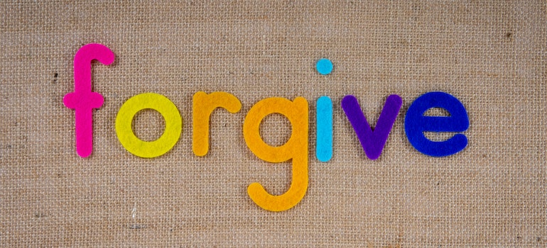 the word forgive on canvas