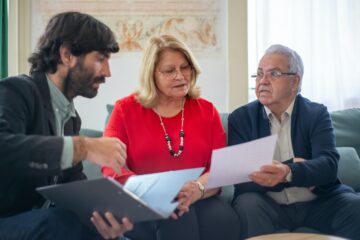 Three people discussing a denied rehab insurance claim