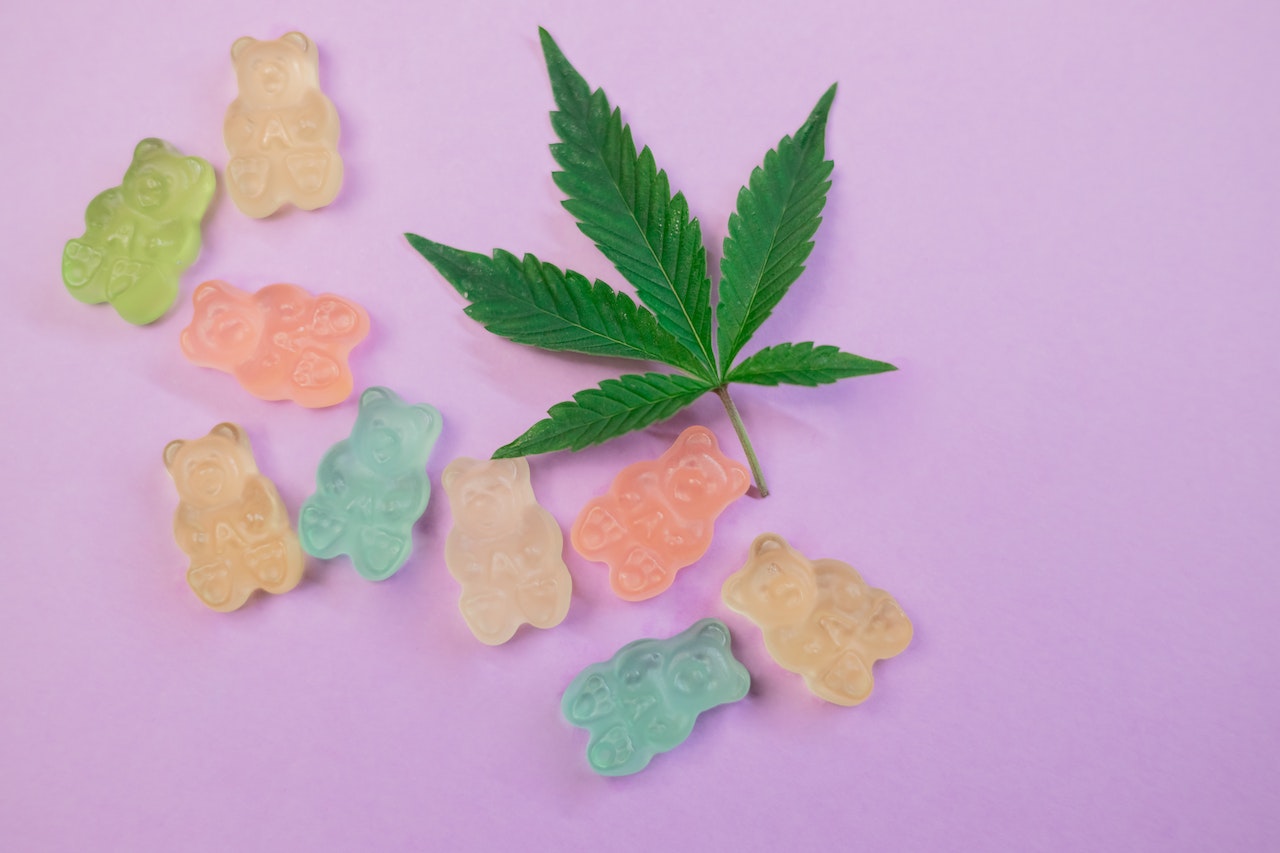 marijuana plant and jelly bears with some drug in it illustrating recreational drug use among teens in Texas